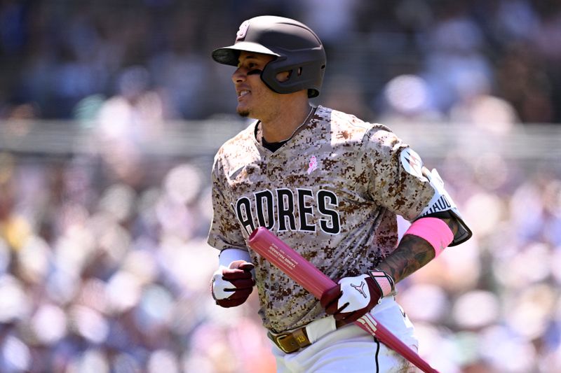 May 12, 2024; San Diego, California, USA; San Diego Padres third baseman Manny Machado (13) looks on after a pop-up out on a bunt attempt during the third inning against the Los Angeles Dodgers at Petco Park. Mandatory Credit: Orlando Ramirez-USA TODAY Sports