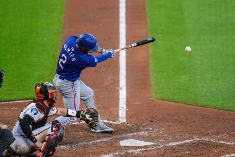 Jun 30, 2024; Baltimore, Maryland, USA; Texas Rangers second base Marcus Semien (2) hits a single during the fourth inning against the Baltimore Orioles at Oriole Park at Camden Yards. Mandatory Credit: Reggie Hildred-USA TODAY Sports
