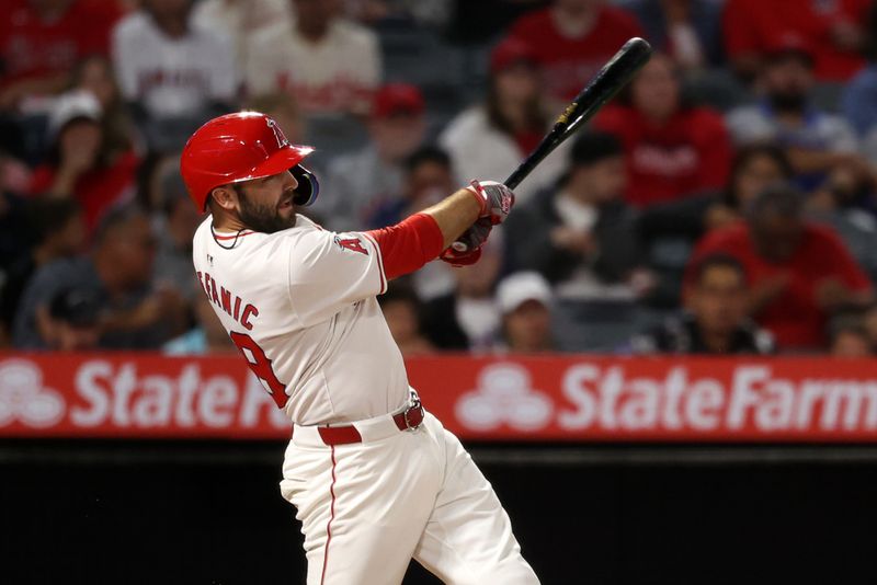 Sep 28, 2024; Anaheim, California, USA;  Los Angeles Angels second baseman Michael Stefanic (38) hits a RBI double during the second inning against the Texas Rangers at Angel Stadium. Mandatory Credit: Kiyoshi Mio-Imagn Images