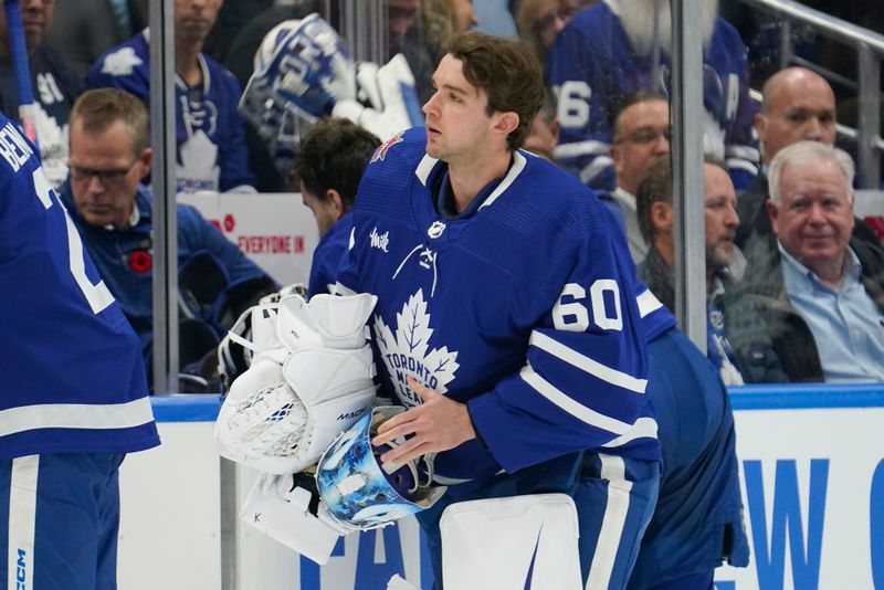 Nov 6, 2023; Toronto, Ontario, CAN; Toronto Maple Leafs goaltender Joseph Woll (60) gets ready to go in for goaltender Ilya Samsonov (35) during a goaltending change part way through the first period against the Tampa Bay Lightning at Scotiabank Arena. Mandatory Credit: John E. Sokolowski-USA TODAY Sports