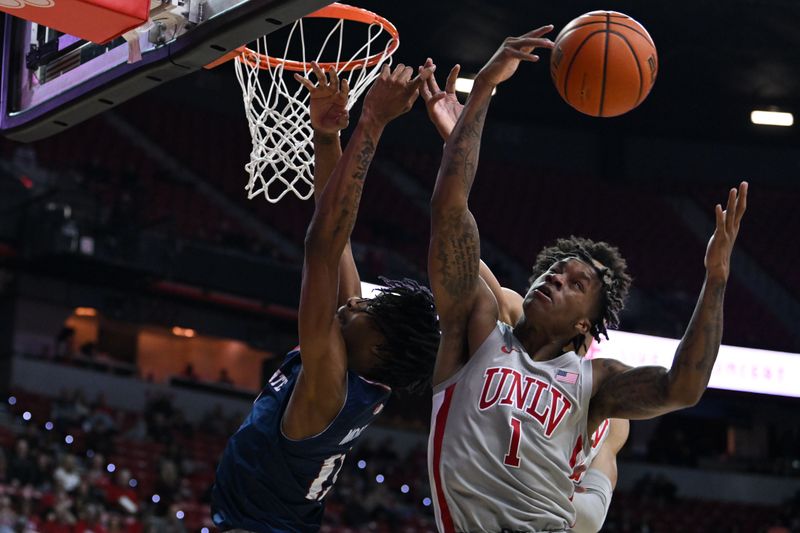 Feb 3, 2023; Las Vegas, Nevada, USA; Fresno State Bulldogs forward Isaih Moore (11) and UNLV Runnin' Rebels guard Elijah Parquet (1) battle for a rebound in the second half at Thomas & Mack Center. Mandatory Credit: Candice Ward-USA TODAY Sports