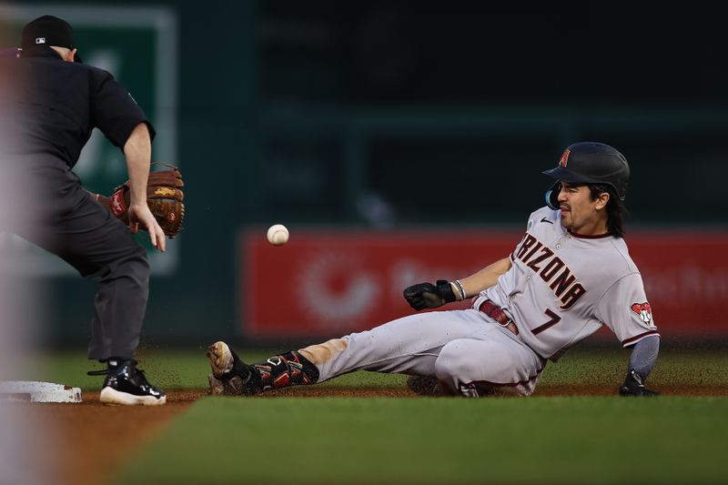 Jun 7, 2023; Washington, District of Columbia, USA; Arizona Diamondbacks left fielder Corbin Carroll (7) attempts to beat the tag of Washington Nationals shortstop CJ Abrams (5) during the fifth inning at Nationals Park.  Corbin Carroll was ruled out on the play. Mandatory Credit: Scott Taetsch-USA TODAY Sports