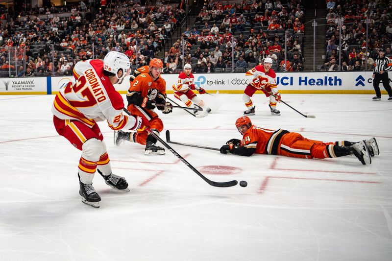 Mar 1, 2026; Anaheim, California, USA; Calgary Flames right wing Matt Coronato (27) passes the puck during the third period against the Anaheim Ducks at Honda Center. Mandatory Credit: Corinne Votaw-Imagn Images