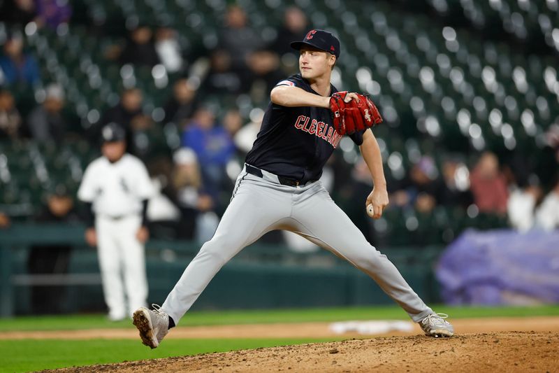 May 9, 2024; Chicago, Illinois, USA; Cleveland Guardians relief pitcher Tim Herrin (29) delivers a pitch against the Chicago White Sox during the eight inning at Guaranteed Rate Field. Mandatory Credit: Kamil Krzaczynski-USA TODAY Sports