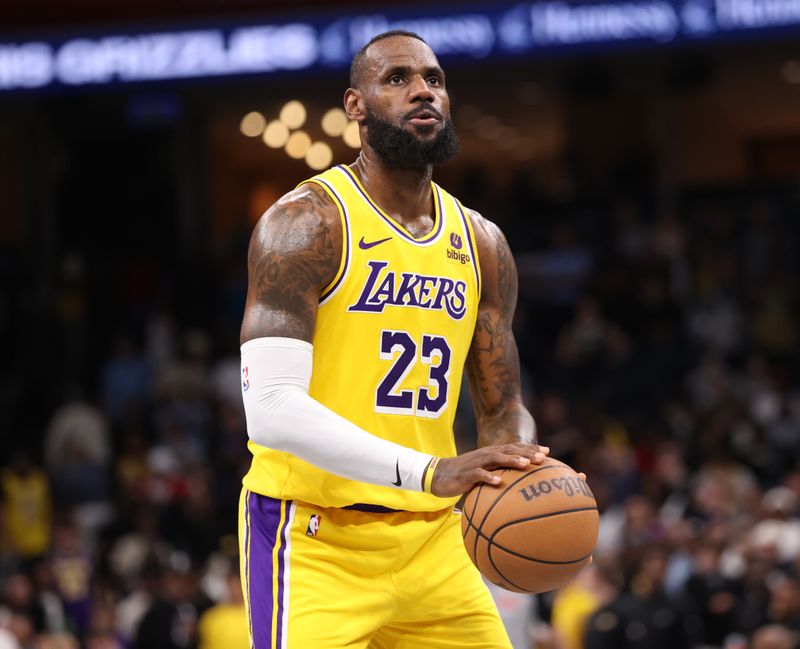 MEMPHIS, TN - APRIL 12: LeBron James #23 of the Los Angeles Lakers shoots a free throw during the game against the Memphis Grizzlies on April 12, 2024 at FedExForum in Memphis, Tennessee. NOTE TO USER: User expressly acknowledges and agrees that, by downloading and or using this photograph, User is consenting to the terms and conditions of the Getty Images License Agreement. Mandatory Copyright Notice: Copyright 2024 NBAE (Photo by Joe Murphy/NBAE via Getty Images)