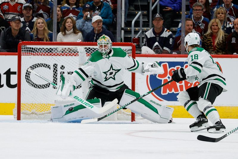 May 11, 2024; Denver, Colorado, USA; Dallas Stars goaltender Jake Oettinger (29) makes a save as center Sam Steel (18) defends in the first period against the Colorado Avalanche in game three of the second round of the 2024 Stanley Cup Playoffs at Ball Arena. Mandatory Credit: Isaiah J. Downing-USA TODAY Sports