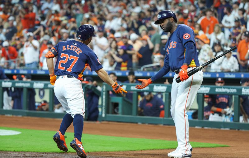 Apr 14, 2024; Houston, Texas, USA; Houston Astros second baseman Jose Altuve (27) celebrates with left fielder Yordan Alvarez (44) after hitting a home run during the first inning against the Texas Rangers at Minute Maid Park. Mandatory Credit: Troy Taormina-USA TODAY Sports