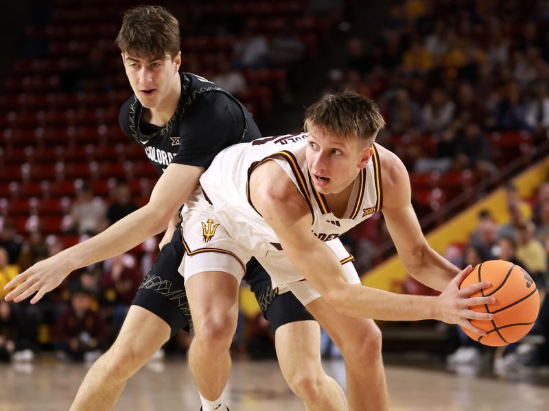 Jan 3, 2026; Tempe, Arizona, USA; Arizona State Sun Devils guard Noah Meeusen (right) controls the ball against Colorado Buffaloes forward Sebastian Rancik (7) in the first half at Desert Financial Arena. Mandatory Credit: Mark J. Rebilas-Imagn Images