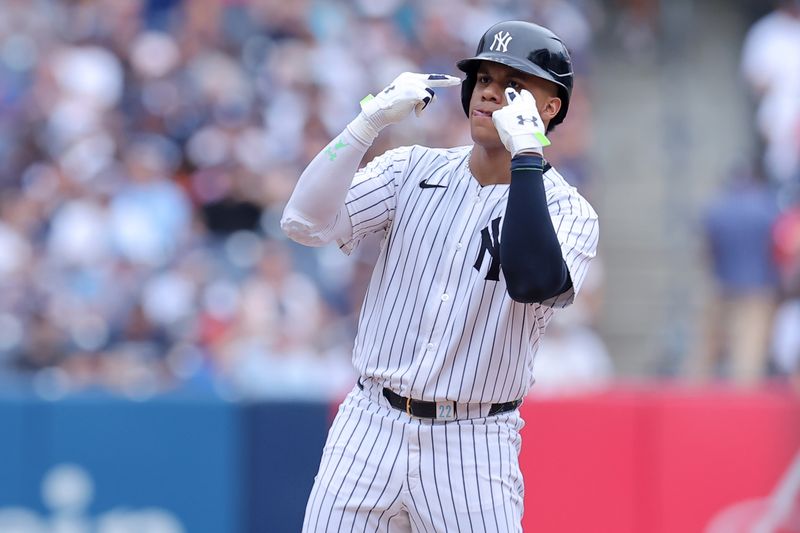 Jul 22, 2024; Bronx, New York, USA; New York Yankees right fielder Juan Soto (22) reacts after hitting a double against the Tampa Bay Rays during the fifth inning at Yankee Stadium. Mandatory Credit: Brad Penner-USA TODAY Sports