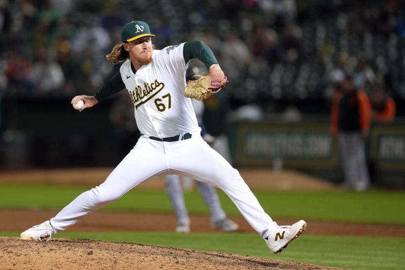 Sep 6, 2024; Oakland, California, USA; Oakland Athletics relief pitcher Grant Holman (67) throws a pitch against the Detroit Tigers during the twelfth inning at Oakland-Alameda County Coliseum. Mandatory Credit: Darren Yamashita-Imagn Images