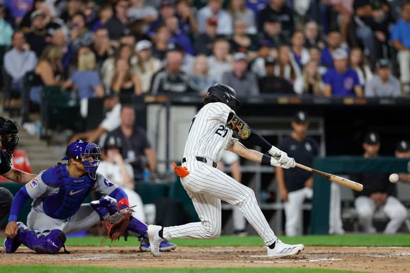 Aug 9, 2024; Chicago, Illinois, USA; Chicago White Sox second baseman Brooks Baldwin (27) hits an RBI-ground out against the Chicago Cubs during the fourth inning at Guaranteed Rate Field. Mandatory Credit: Kamil Krzaczynski-USA TODAY Sports