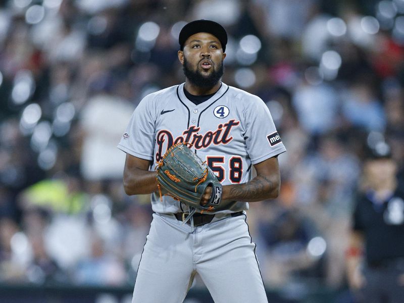 Jun 2, 2025; Chicago, Illinois, USA; Detroit Tigers relief pitcher Dylan Smith (58) delivers a pitch against the Chicago White Sox during the seventh inning at Rate Field. Mandatory Credit: Kamil Krzaczynski-Imagn Images