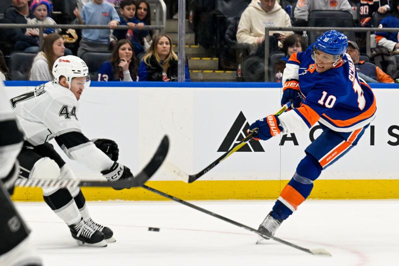 Mar 13, 2026; Elmont, New York, USA; New York Islanders center Brayden Schenn (10) attempts a shot defended by Los Angeles Kings defenseman Mikey Anderson (44) during the second period at UBS Arena. Mandatory Credit: Dennis Schneidler-Imagn Images Mar 13, 2026; Elmont, New York, USA; New York Islanders center Brayden Schenn (10) attempts a shot defended by Los Angeles Kings defenseman Mikey Anderson (44) during the second period at UBS Arena. Mandatory Credit: Dennis Schneidler-Imagn Images