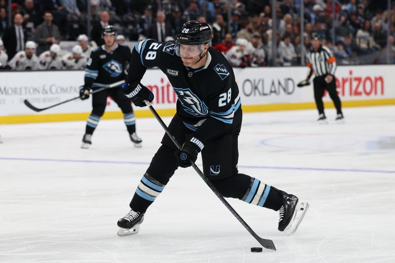 Mar 12, 2026; Salt Lake City, Utah, USA; Utah Mammoth defenseman Ian Cole (28) takes a shot against the Chicago Blackhawks during the second period at Delta Center. Mandatory Credit: Rob Gray-Imagn Images