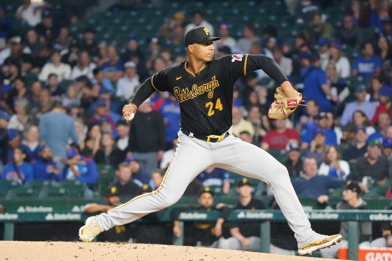 Sep 21, 2023; Chicago, Illinois, USA; Pittsburgh Pirates starting pitcher Johan Oviedo (24) throws the ball against the Chicago Cubs during the first inning at Wrigley Field. Mandatory Credit: David Banks-USA TODAY Sports