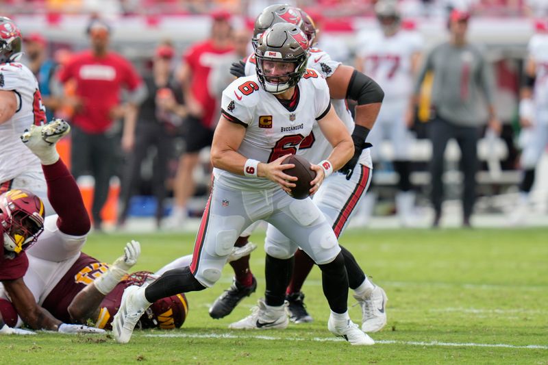 Tampa Bay Buccaneers quarterback Baker Mayfield (6) looks for a receiver during the first half of an NFL football game against the Washington Commanders Sunday, Sept. 8, 2024, in Tampa, Fla. (AP Photo/Chris O'Meara)