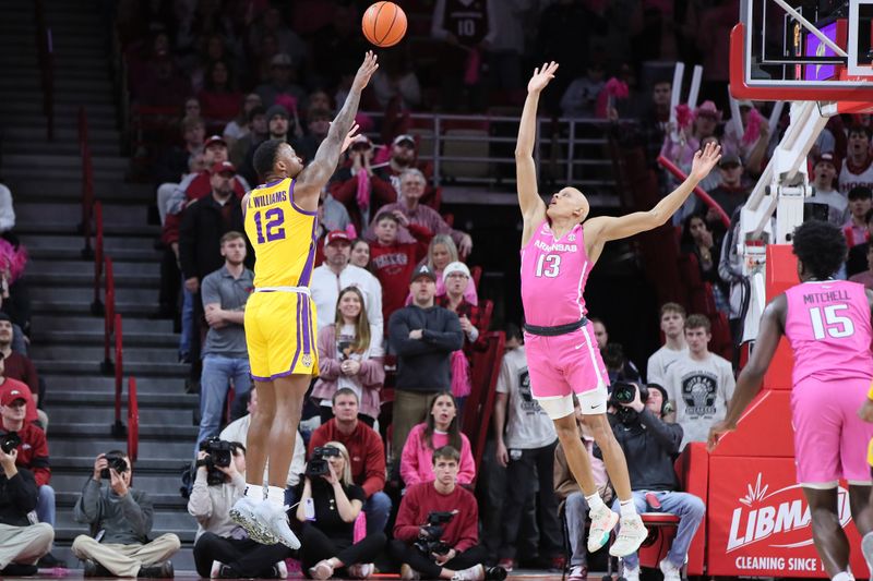 Jan 24, 2023; Fayetteville, Arkansas, USA; LSU Tigers forward KJ Williams (12) shoots over Arkansas Razorbacks guard Jordan Walsh (13) during the second half at Bud Walton Arena. Arkansas won 60-40. Mandatory Credit: Nelson Chenault-USA TODAY Sports