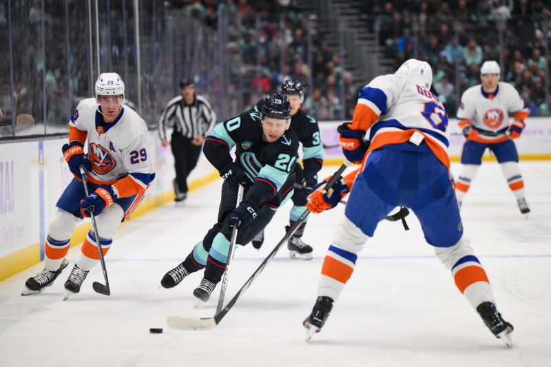 Nov 16, 2023; Seattle, Washington, USA; Seattle Kraken right wing Eeli Tolvanen (20) advances the puck against the New York Islanders during the first period at Climate Pledge Arena. Mandatory Credit: Steven Bisig-USA TODAY Sports