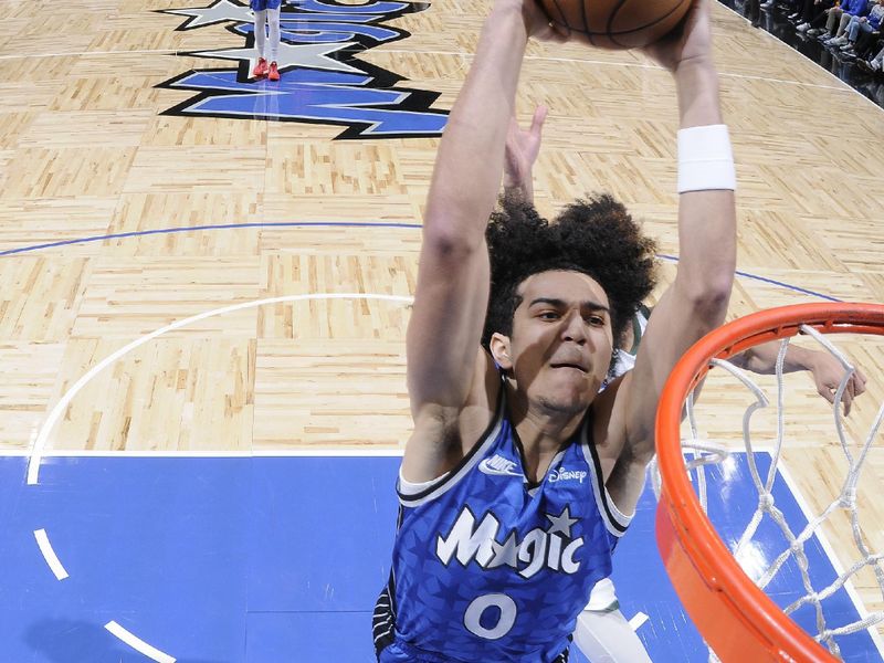 ORLANDO, FL - APRIL 14: Anthony Black #0 of the Orlando Magic dunks the ball during the game against the Milwaukee Bucks on April 14, 2024 at Kia Center in Orlando, Florida. NOTE TO USER: User expressly acknowledges and agrees that, by downloading and or using this photograph, User is consenting to the terms and conditions of the Getty Images License Agreement. Mandatory Copyright Notice: Copyright 2024 NBAE (Photo by Fernando Medina/NBAE via Getty Images)