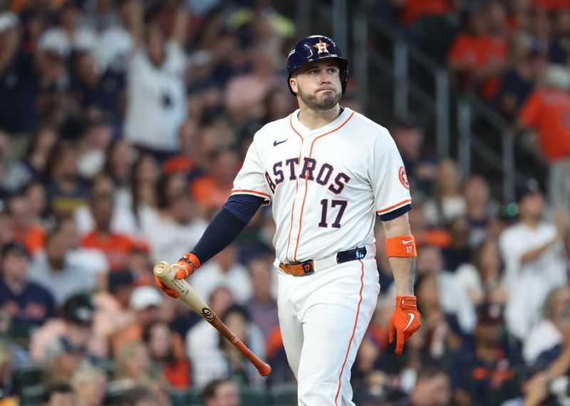 Oct 1, 2024; Houston, Texas, USA; Houston Astros first baseman Victor Caratini (17) reacts after striking out against the Detroit Tigers in the fourth inning in game one of the Wild Card round for the 2024 MLB Playoffs at Minute Maid Park. Mandatory Credit: Troy Taormina-Imagn Images