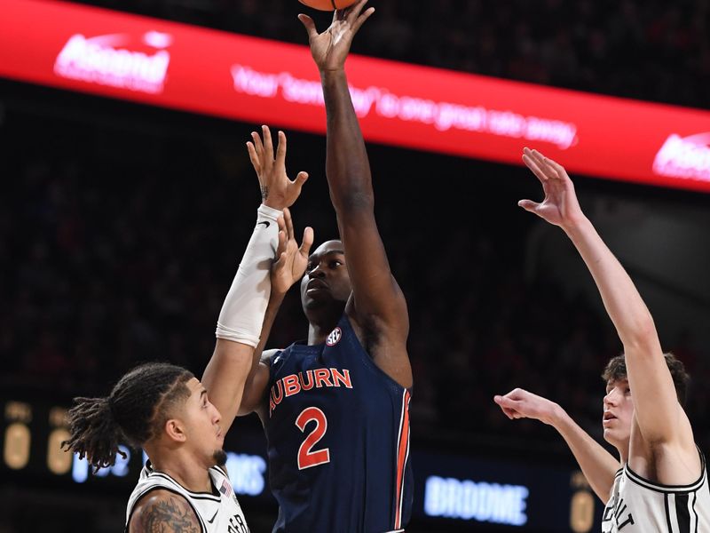 Feb 18, 2023; Nashville, Tennessee, USA; Auburn Tigers forward Jaylin Williams (2) shoots against Vanderbilt Commodores forward Myles Stute (10) during the first half at Memorial Gymnasium. Mandatory Credit: Christopher Hanewinckel-USA TODAY Sports