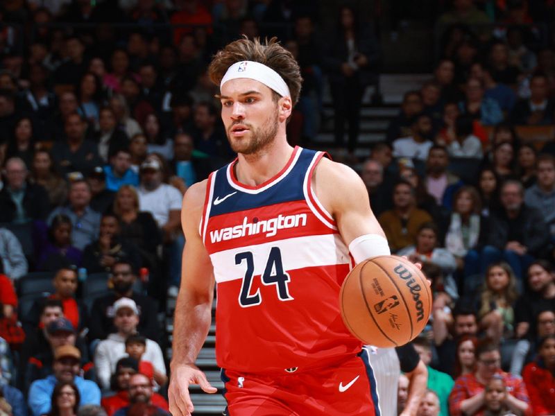 TORONTO, CANADA - OCTOBER 20: Corey Kispert #24 of the Washington Wizards handles the ball during the game against the Toronto Raptors on October 20, 2023 at the Scotiabank Arena in Toronto, Ontario, Canada.  NOTE TO USER: User expressly acknowledges and agrees that, by downloading and or using this Photograph, user is consenting to the terms and conditions of the Getty Images License Agreement.  Mandatory Copyright Notice: Copyright 2023 NBAE (Photo by Vaughn Ridley/NBAE via Getty Images)