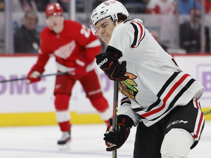 Nov 30, 2023; Detroit, Michigan, USA; Chicago Blackhawks center Connor Bedard (98) takes a shot in the third period against the Detroit Red Wings at Little Caesars Arena. Mandatory Credit: Rick Osentoski-USA TODAY Sports