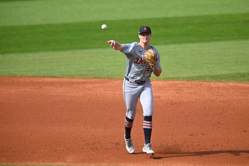 Oct 12, 2024; Cleveland, Ohio, USA; Detroit Tigers shortstop Trey Sweeney (27) throws to first base in the second inning against the Cleveland Guardians during game five of the ALDS for the 2024 MLB Playoffs at Progressive Field. Mandatory Credit: David Richard-Imagn Images
