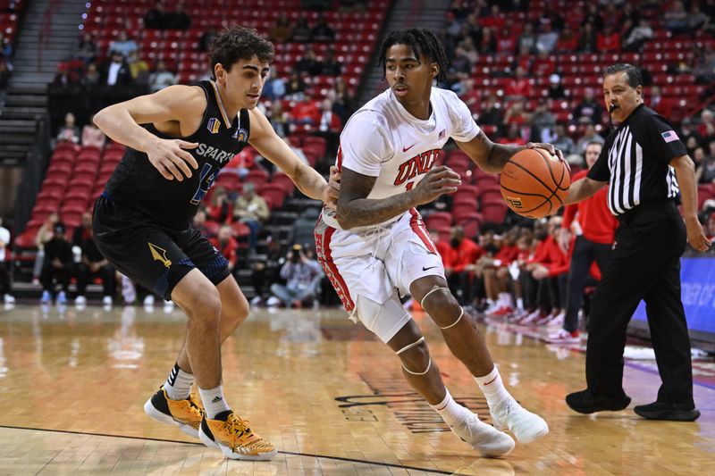 Feb 14, 2023; Las Vegas, Nevada, USA; San Jose State Spartans guard Alvaro Cardenas (13) guards UNLV Runnin' Rebels guard Keshon Gilbert (10) in the first half at Thomas & Mack Center. Mandatory Credit: Candice Ward-USA TODAY Sports