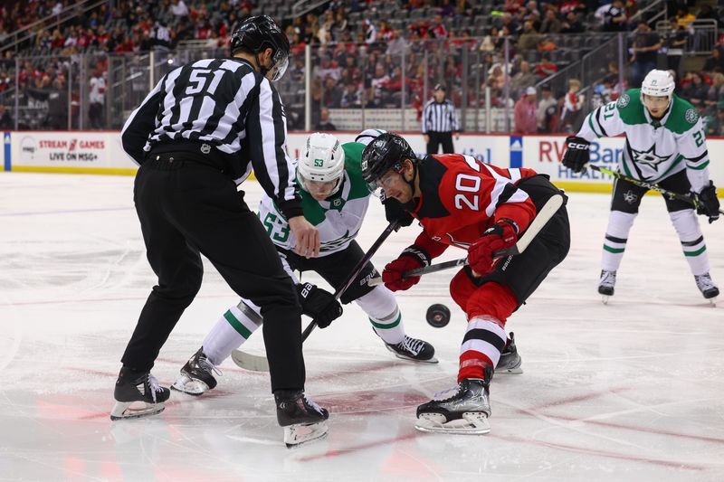 Jan 20, 2024; Newark, New Jersey, USA; Dallas Stars center Wyatt Johnston (53) and New Jersey Devils center Michael McLeod (20) face-off during the third period at Prudential Center. Mandatory Credit: Ed Mulholland-USA TODAY Sports