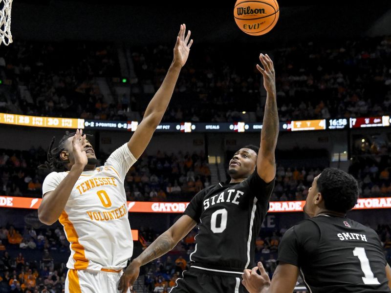 Mar 15, 2024; Nashville, TN, USA; Mississippi State Bulldogs forward D.J. Jeffries (0) shoots over Tennessee Volunteers forward Jonas Aidoo (0) during the first half at Bridgestone Arena. Mandatory Credit: Steve Roberts-USA TODAY Sports