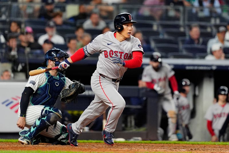 Sep 12, 2024; Bronx, New York, USA; Boston Red Sox left fielder Masataka Yoshida (7) runs out a ground ball against the New York Yankees during the ninth inning at Yankee Stadium. Mandatory Credit: Gregory Fisher-Imagn Images