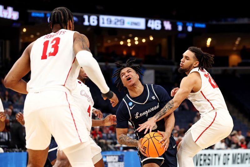 Mar 22, 2024; Memphis, TN, USA;  Longwood Lancers guard DA Houston (3) drives to the basket against Houston Cougars guard Emanuel Sharp (21) during the second half in the first round of the 2024 NCAA Tournament at FedExForum. Mandatory Credit: Petre Thomas-USA TODAY Sports