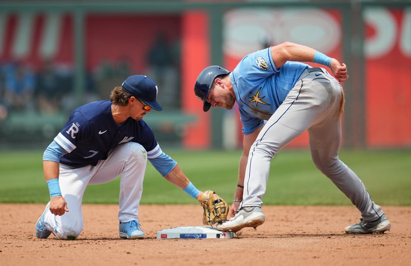 Jul 15, 2023; Kansas City, Missouri, USA; Tampa Bay Rays first baseman Luke Raley (55) steals second base as Kansas City Royals shortstop Bobby Witt Jr. (7) applies the tag during the sixth inning at Kauffman Stadium. Mandatory Credit: Jay Biggerstaff-USA TODAY Sports