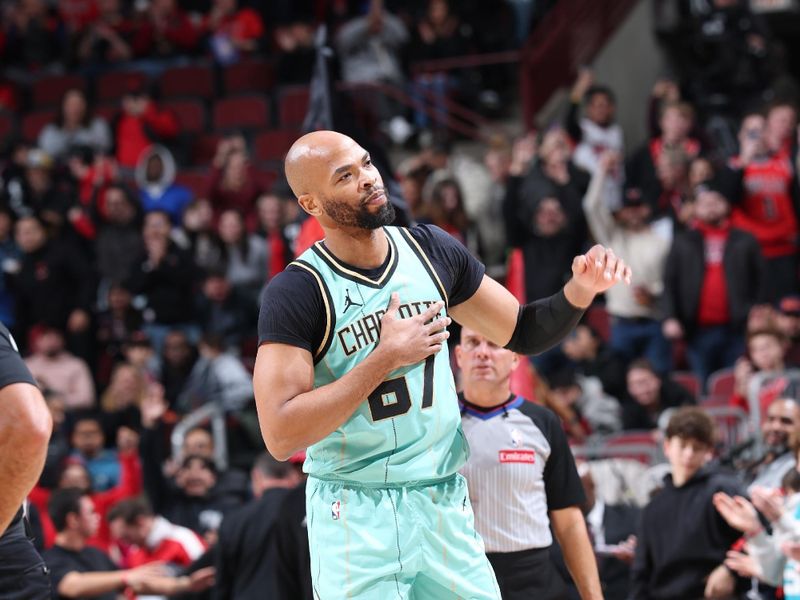 CHICAGO, IL - DECEMBER 13: Taj Gibson #67 of the Charlotte Hornets waves to the crowd  during the game against the Chicago Bulls  on December 13, 2024 at United Center in Chicago, Illinois. NOTE TO USER: User expressly acknowledges and agrees that, by downloading and or using this photograph, User is consenting to the terms and conditions of the Getty Images License Agreement. Mandatory Copyright Notice: Copyright 2024 NBAE (Photo by Jeff Haynes/NBAE via Getty Images)