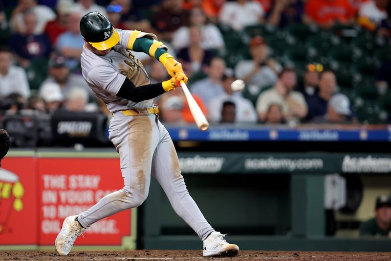 Sep 12, 2024; Houston, Texas, USA; Oakland Athletics designated hitter Brent Rooker (25) hits a home run to left field against the Houston Astros during the eighth inning at Minute Maid Park. Mandatory Credit: Erik Williams-Imagn Images