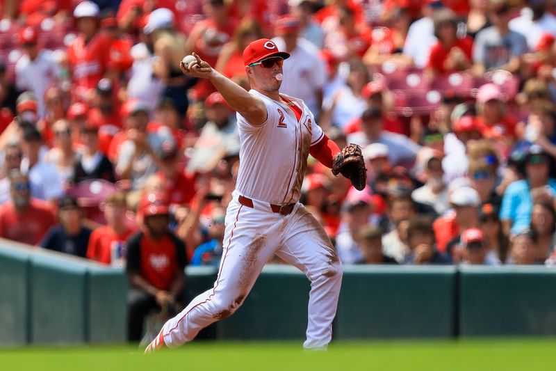 Aug 4, 2024; Cincinnati, Ohio, USA; Cincinnati Reds first baseman Ty France (2) throws to first to get San Francisco Giants first baseman LaMonte Wade Jr. (not pictured) out in the first inning at Great American Ball Park. Mandatory Credit: Katie Stratman-USA TODAY Sports