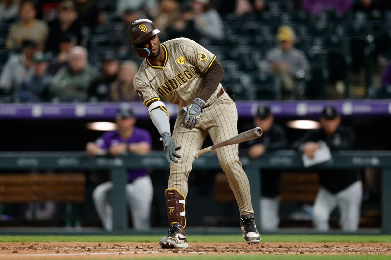 Apr 22, 2024; Denver, Colorado, USA; San Diego Padres designated hitter Jurickson Profar (10) tosses his bat after being walked in the eighth inning against the Colorado Rockies at Coors Field. Mandatory Credit: Isaiah J. Downing-USA TODAY Sports