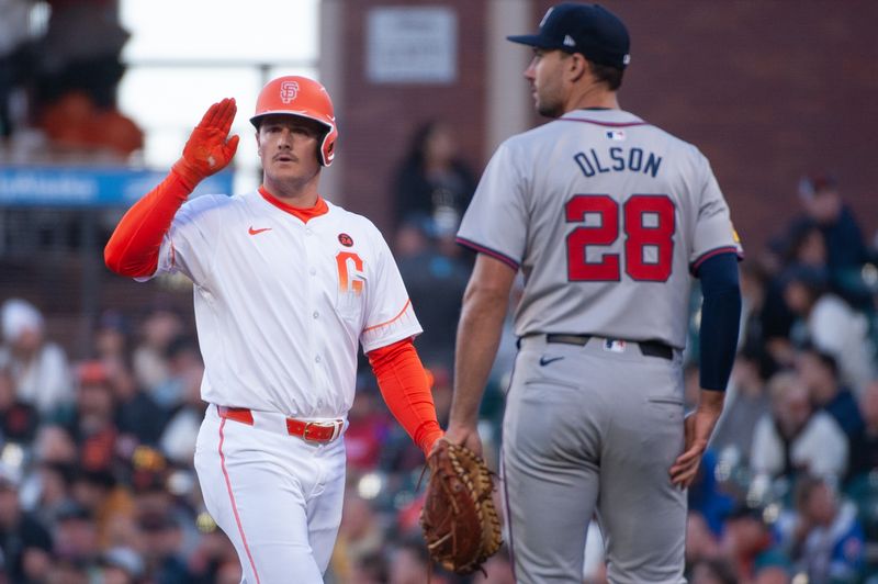 Aug 13, 2024; San Francisco, California, USA;  San Francisco Giants third baseman Matt Chapman (26) motions to teammates after hitting a single against the Atlanta Braves during the second inning at Oracle Park. Mandatory Credit: Ed Szczepanski-USA TODAY Sports