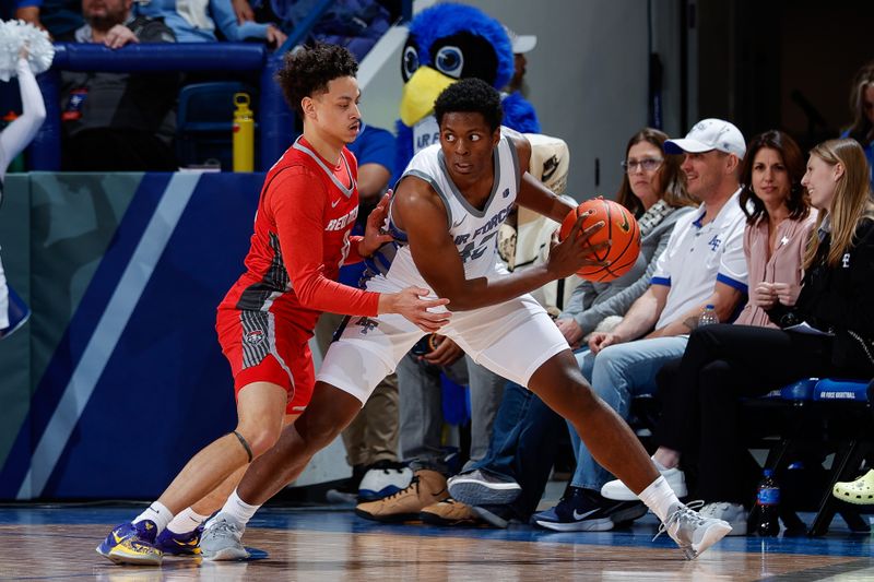 Feb 10, 2023; Colorado Springs, Colorado, USA; Air Force Falcons guard Marcell McCreary (42) controls the ball as New Mexico Lobos guard KJ Jenkins (0) guards in the first half at Clune Arena. Mandatory Credit: Isaiah J. Downing-USA TODAY Sports