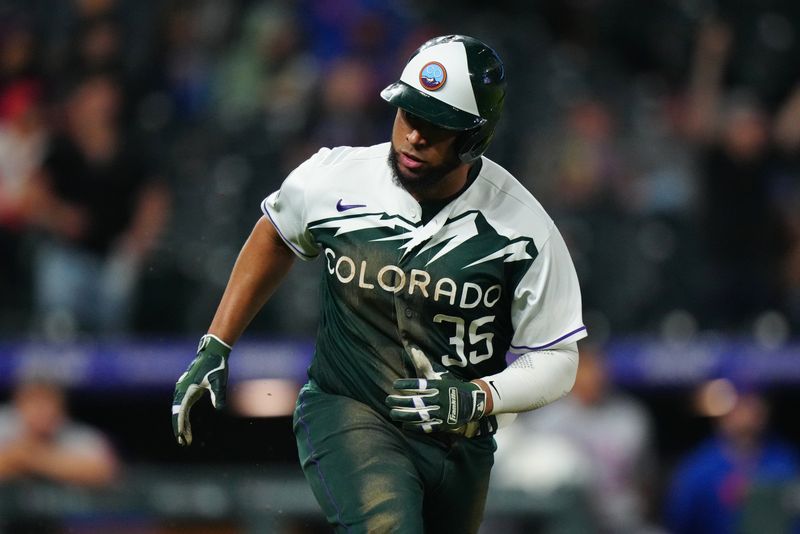 May 27, 2023; Denver, Colorado, USA; Colorado Rockies catcher Elias Diaz (35) reacts after hitting a RBI single against the New York Mets in the eighth inning at Coors Field. Mandatory Credit: Ron Chenoy-USA TODAY Sports