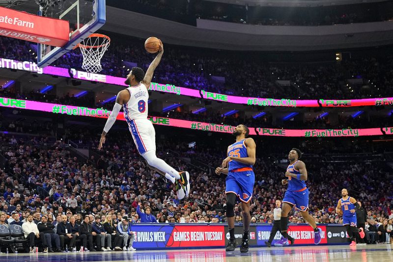 PHILADELPHIA, PENNSYLVANIA - JANUARY 15: Paul George #8 of the Philadelphia 76ers dunks the ball past Mikal Bridges #25 of the New York Knicks in the first half at the Wells Fargo Center on January 15, 2025 in Philadelphia, Pennsylvania. NOTE TO USER: User expressly acknowledges and agrees that, by downloading and/or using this photograph, user is consenting to the terms and conditions of the Getty Images License Agreement. (Photo by Mitchell Leff/Getty Images)