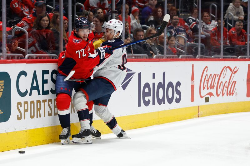 Sep 27, 2024; Washington, District of Columbia, USA; Washington Capitals forward Pierrick Dube (72) and Columbus Blue Jackets left wing Mikael Pyyhtia (82) battle for the puck in the third period at Capital One Arena. Mandatory Credit: Geoff Burke-Imagn Images