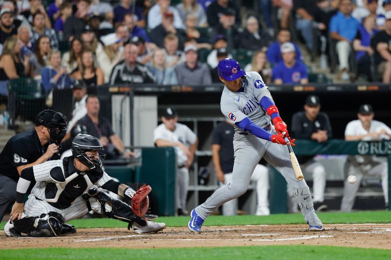 Aug 9, 2024; Chicago, Illinois, USA; Chicago Cubs catcher Miguel Amaya (9) hits an RBI-ground out against the Chicago White Sox during the third inning at Guaranteed Rate Field. Mandatory Credit: Kamil Krzaczynski-USA TODAY Sports