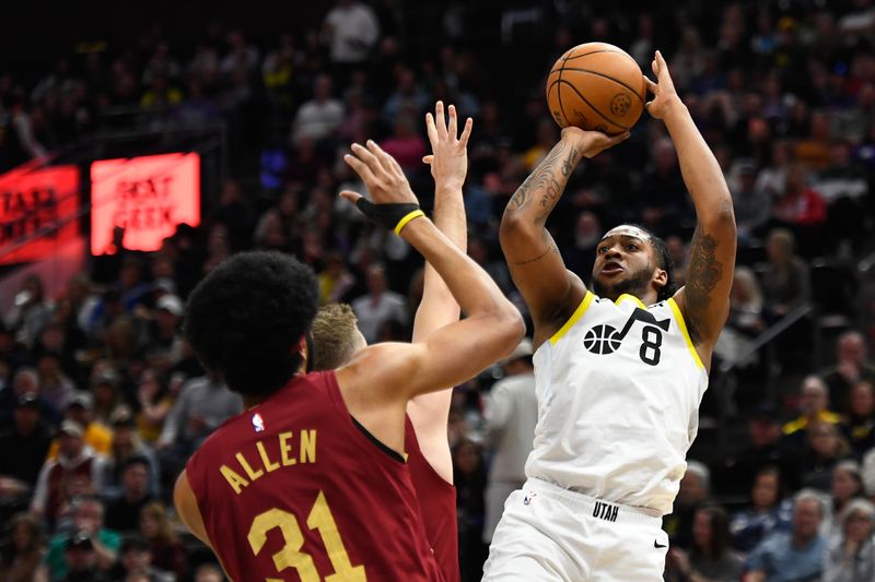 SALT LAKE CITY, UTAH - APRIL 02: Brice Sensabaugh #8 of the Utah Jazz shoots over Sam Merrill #5 of the Cleveland Cavaliers during the first half of a game at Delta Center on April 02, 2024 in Salt Lake City, Utah. NOTE TO USER: User expressly acknowledges and agrees that, by downloading and or using this photograph, User is consenting to the terms and conditions of the Getty Images License Agreement. (Photo by Alex Goodlett/Getty Images)