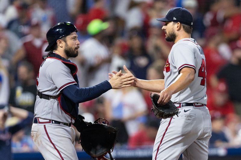 Sep 12, 2023; Philadelphia, Pennsylvania, USA; Atlanta Braves relief pitcher Brad Hand (45) and catcher Travis d'Arnaud (16) shake hands after a win against the Philadelphia Phillies at Citizens Bank Park. Mandatory Credit: Bill Streicher-USA TODAY Sports