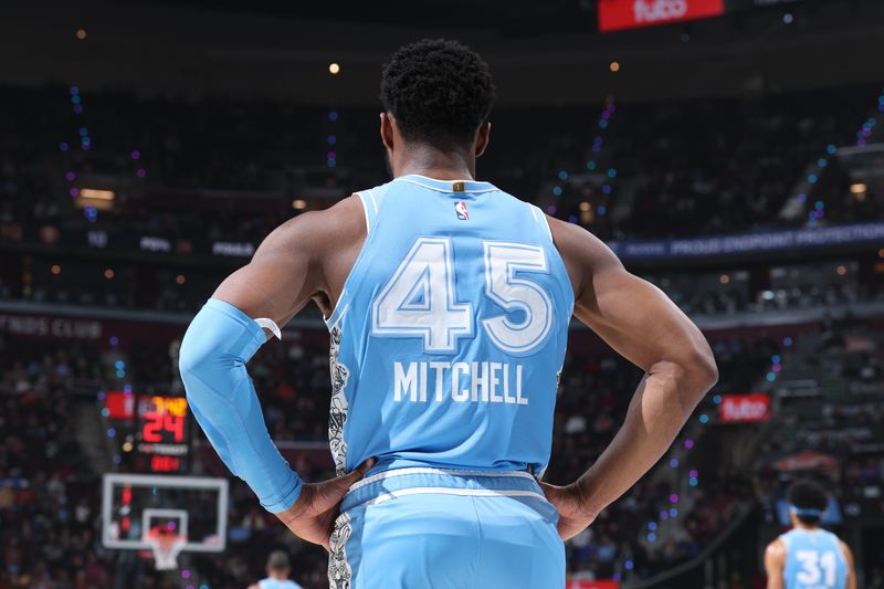 CLEVELAND, OH - DECEMBER 5: Donovan Mitchell #45 of the Cleveland Cavaliers looks on during the game against the Denver Nuggets on December 5, 2024 at Rocket Mortgage FieldHouse in Cleveland, Ohio. NOTE TO USER: User expressly acknowledges and agrees that, by downloading and or using this photograph, User is consenting to the terms and conditions of the Getty Images License Agreement. Mandatory Copyright Notice: Copyright 2024 NBAE (Photo by Jeff Haynes/NBAE via Getty Images)