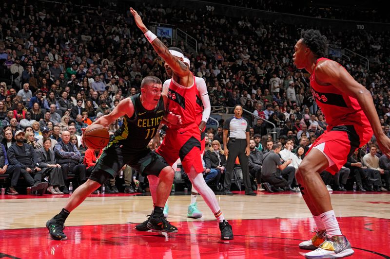 TORONTO, CANADA - JANUARY 15: Payton Pritchard #11 of the Boston Celtics drives to the basket during the game against the Toronto Raptors on January 15, 2025 at the Scotiabank Arena in Toronto, Ontario, Canada.  NOTE TO USER: User expressly acknowledges and agrees that, by downloading and or using this Photograph, user is consenting to the terms and conditions of the Getty Images License Agreement.  Mandatory Copyright Notice: Copyright 2025 NBAE (Photo by Mark Blinch/NBAE via Getty Images)