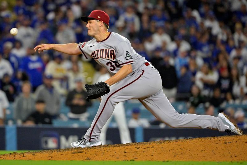 Oct 9, 2023; Los Angeles, California, USA; Arizona Diamondbacks relief pitcher Paul Sewald (38) throws a pitch against the Los Angeles Dodgers in game two of the NLDS for the 2023 MLB playoffs at Dodger Stadium. Mandatory Credit: Jayne Kamin-Oncea-USA TODAY Sports