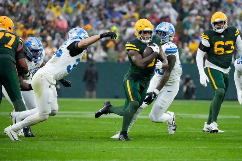 Green Bay Packers running back Josh Jacobs runs against the Detroit Lions during the first half of an NFL football game Sunday, Nov. 3, 2024, in Green Bay, Wis. (AP Photo/Morry Gash)